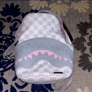 SPRAYGROND backpack it is pink and gray